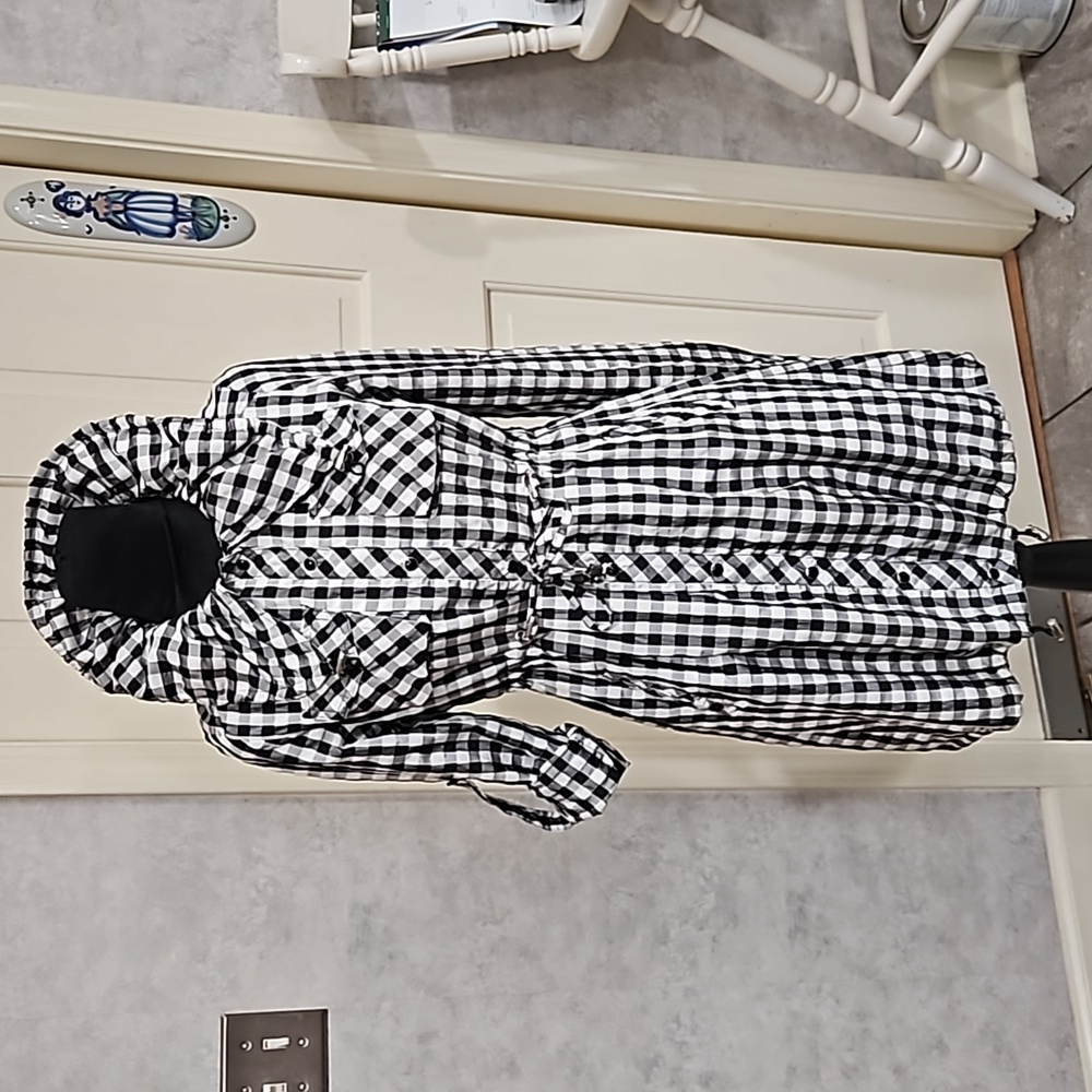 "TOUCH" Black and white check raincoat. No size listed. Polyester and cotton.